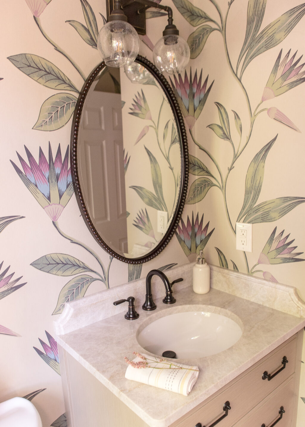 Powder room with orchid wallpaper