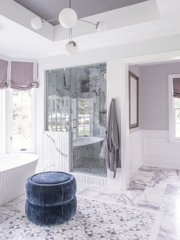 Bathroom with blue ottoman and purple accents