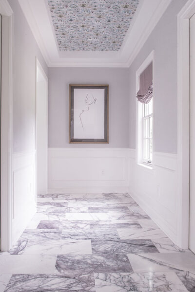 Entrance to bathroom with purple accents Entrance to bathroom with purple accents