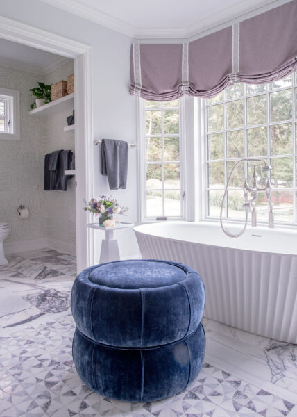 Soaking tub and blue ottoman Soaking tub and blue ottoman