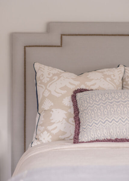 Upholstered headboard and custom pillows