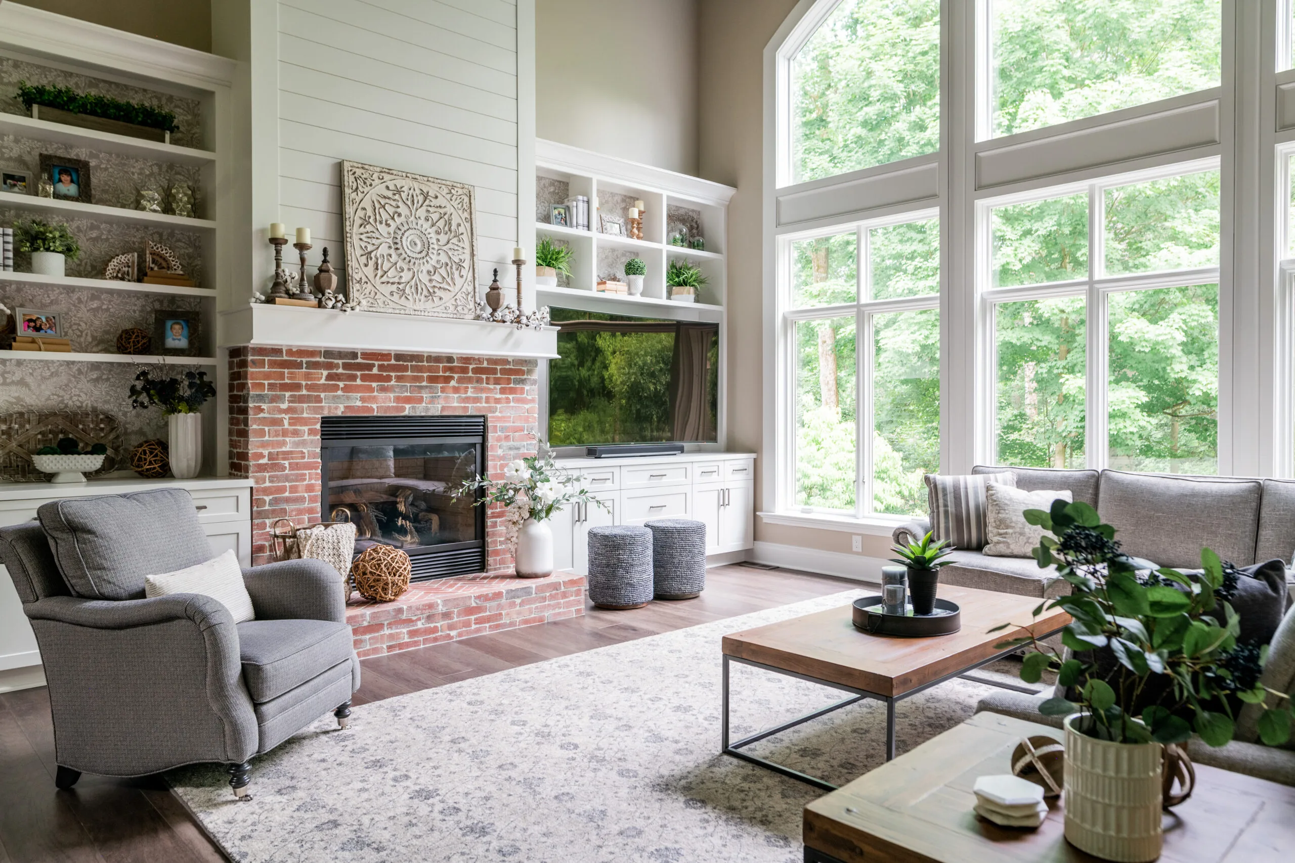 2 story great room with brick fireplace, built ins and sectional furniture
