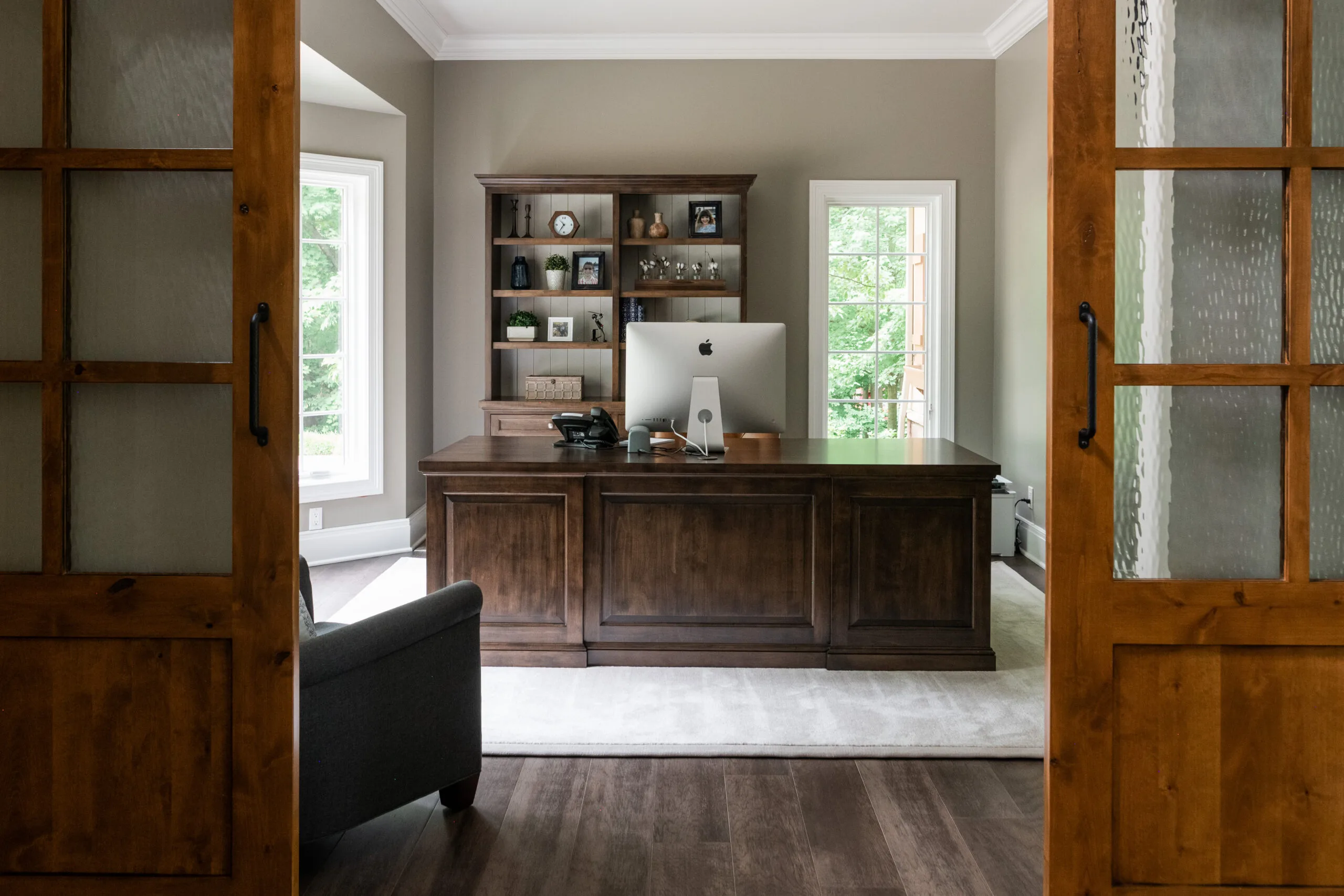 View of office with large desk and leather cahir