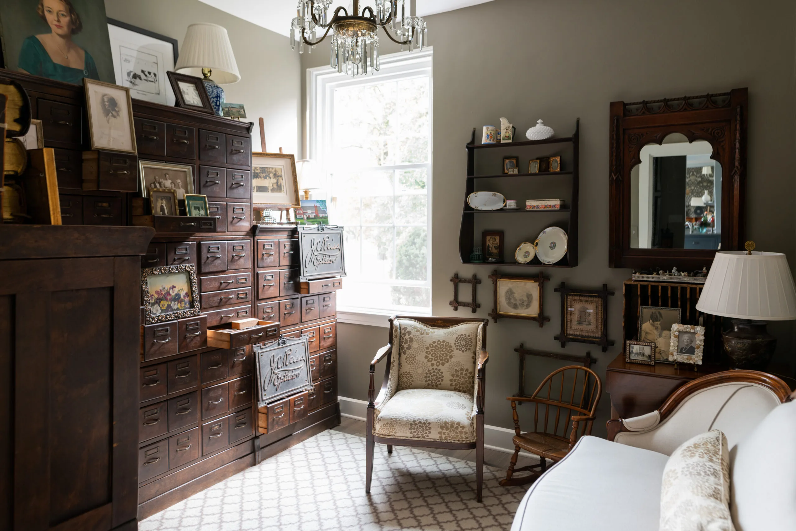 Formal sitting room carefully curated with family heirloom pieces and antique artwork