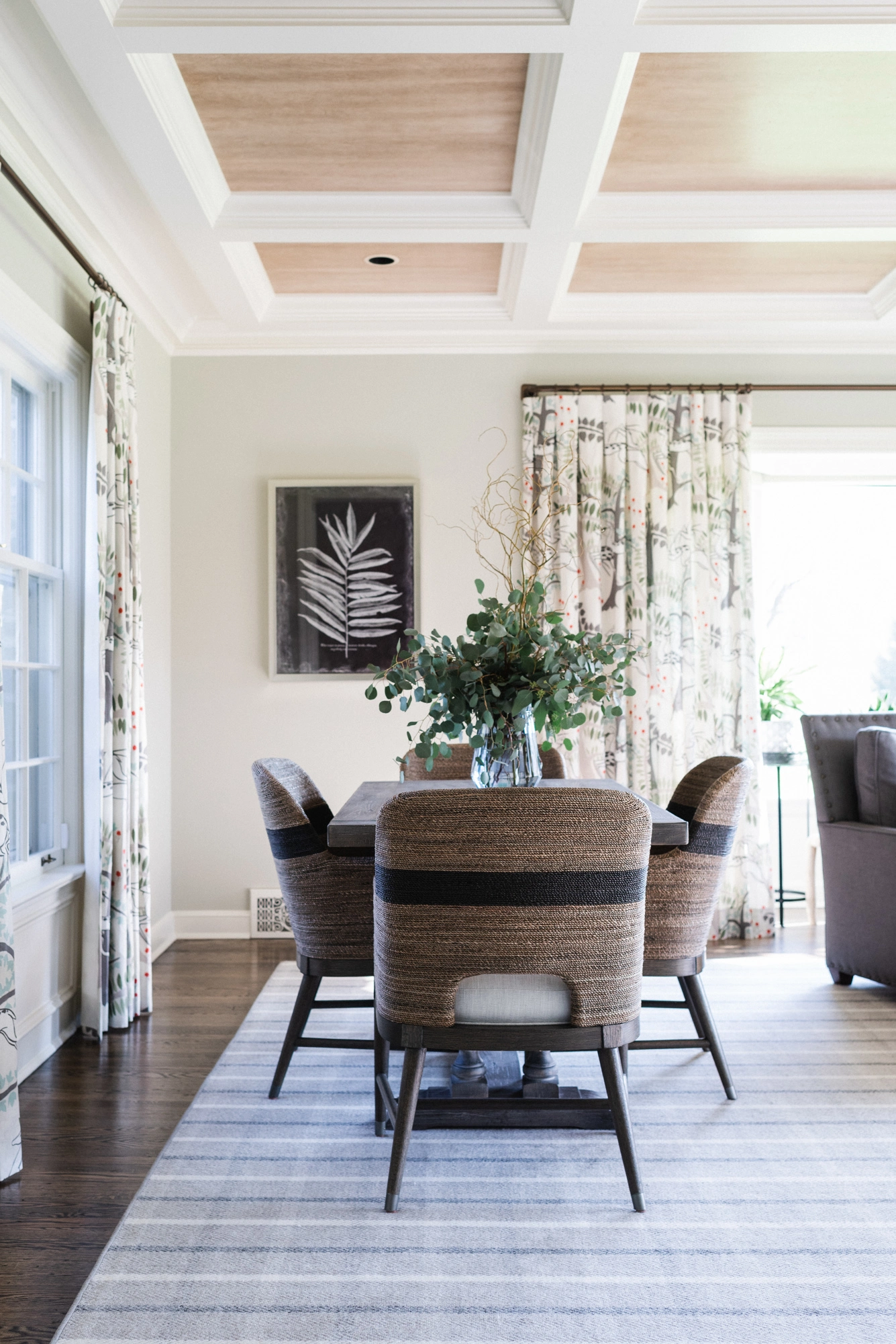 seating area in living room highlighting coffered ceiling detail