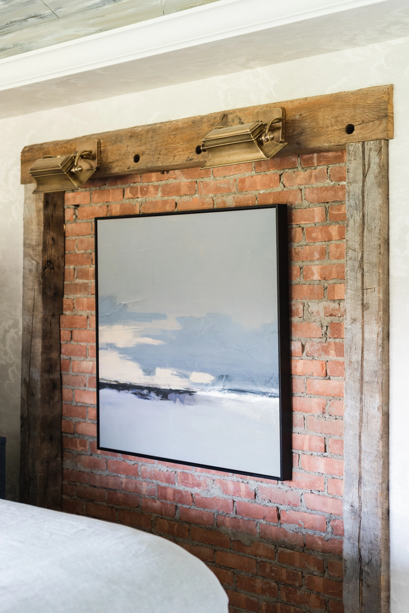 exposed brick wall with artwork