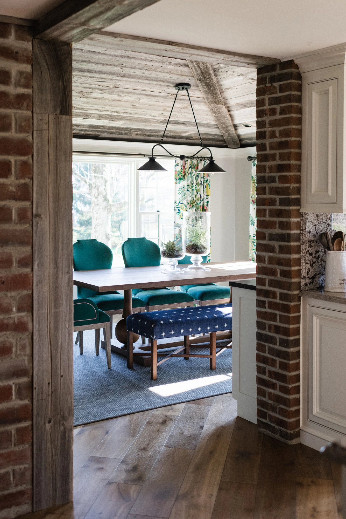 view of dining room with exposed brick