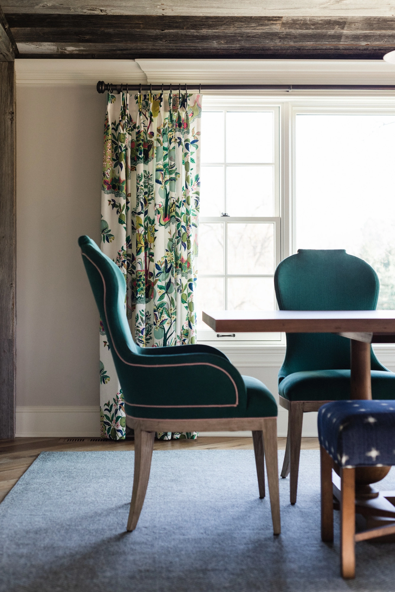 dining room with patterned curtains