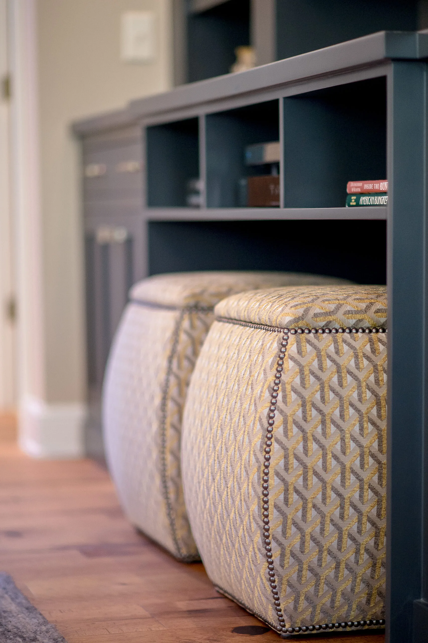 close up photo of newly upholstered stools that sit under the tv