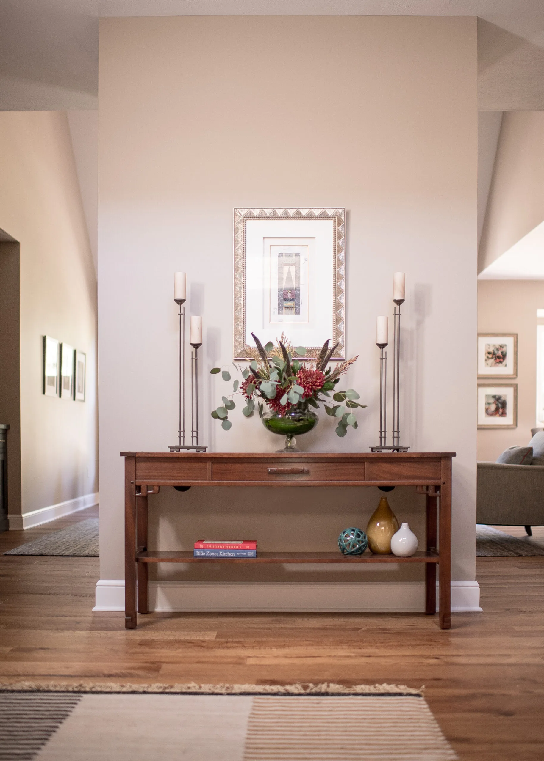 Entryway with console table and art