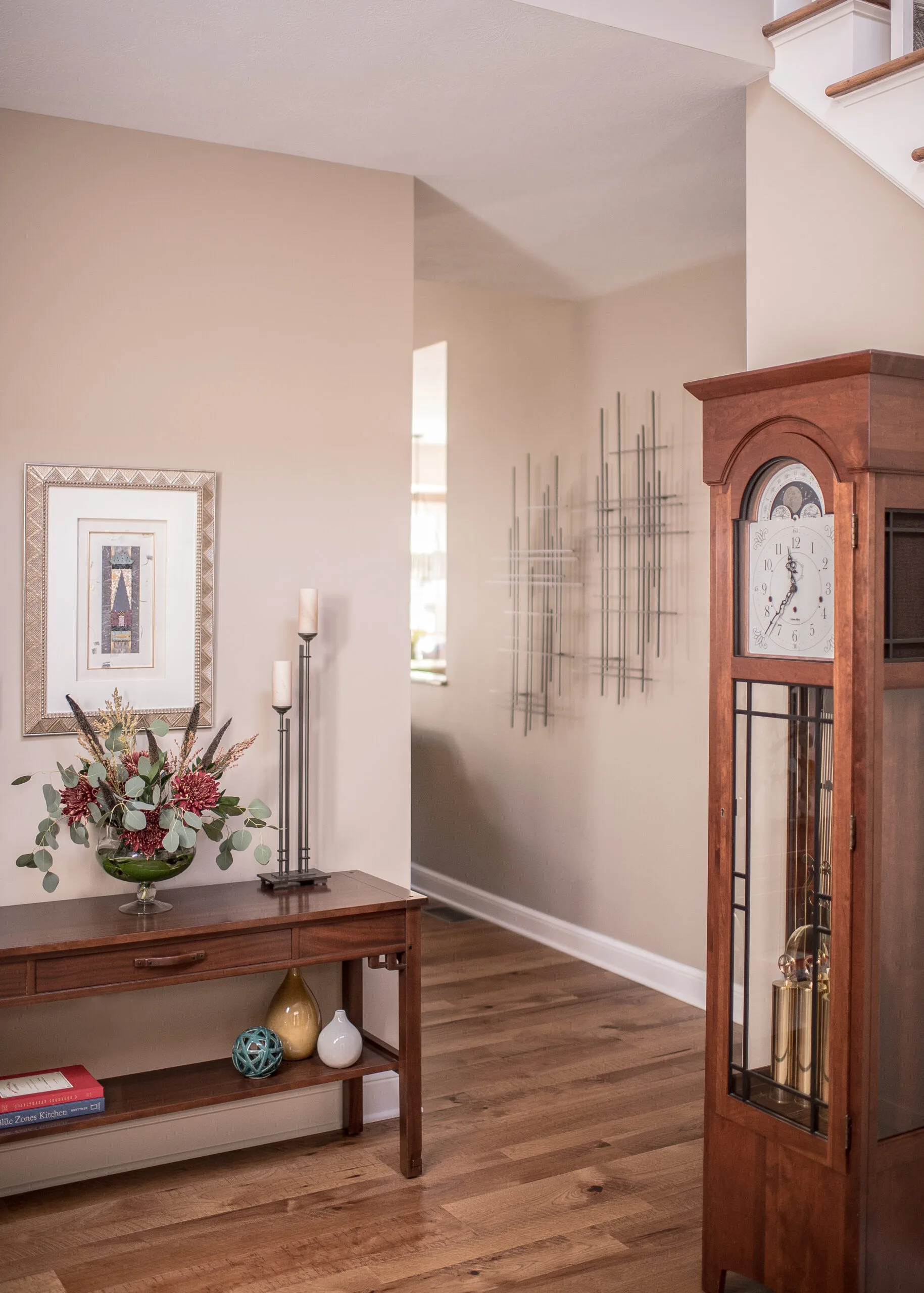 Entryway with console table and grandfather clock