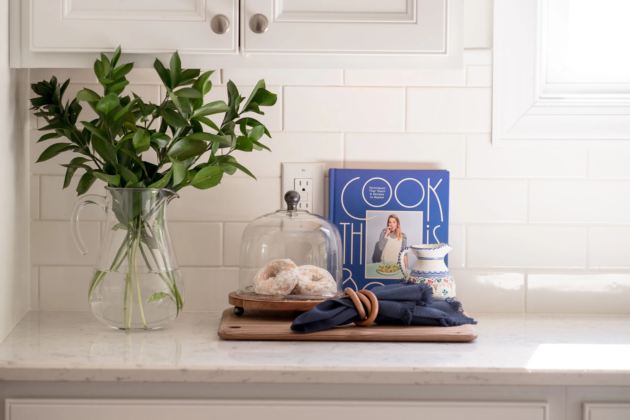 fresh flowers and cookbooks on the kitchen countertop