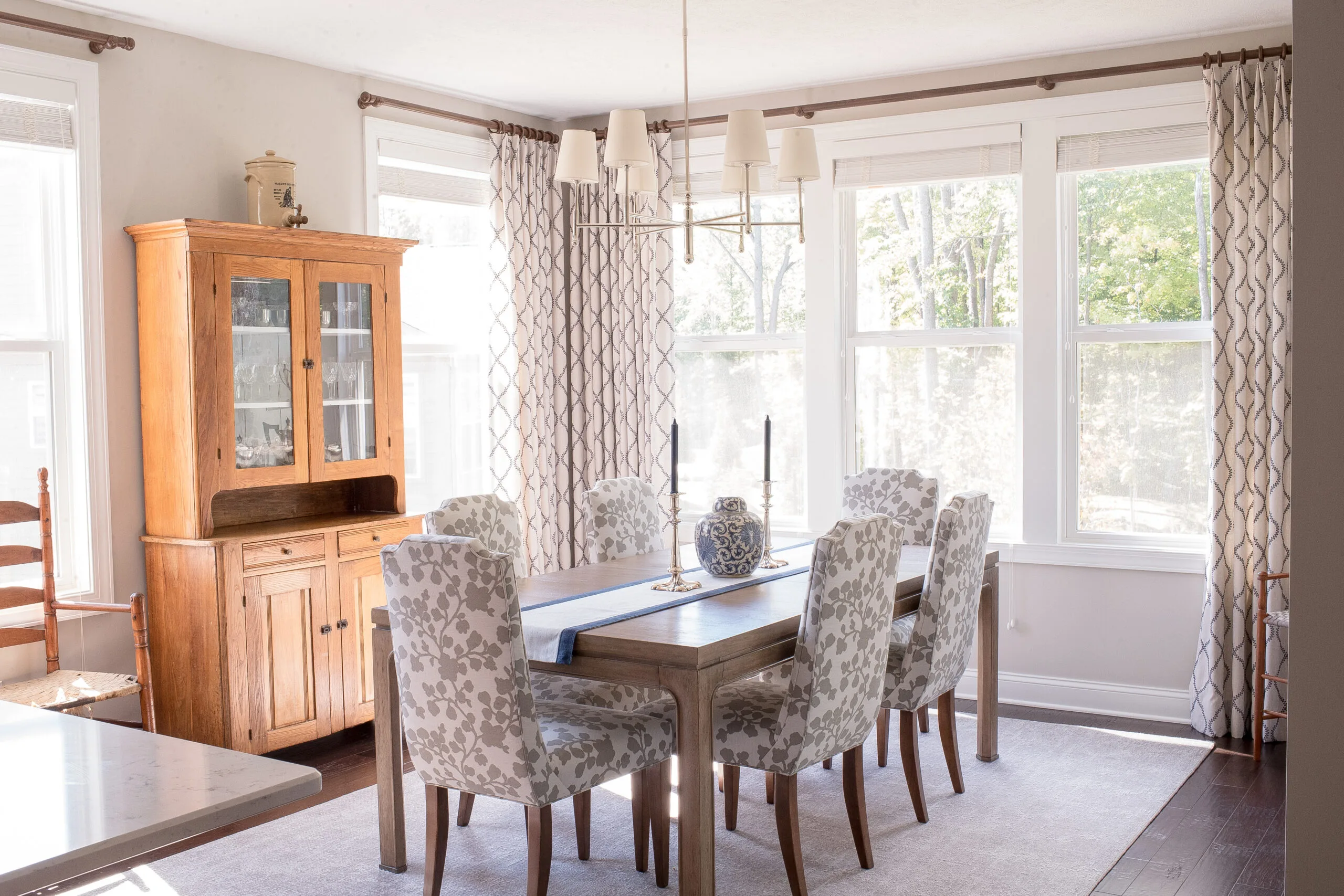dining room table with wooden cabinet against the back wall