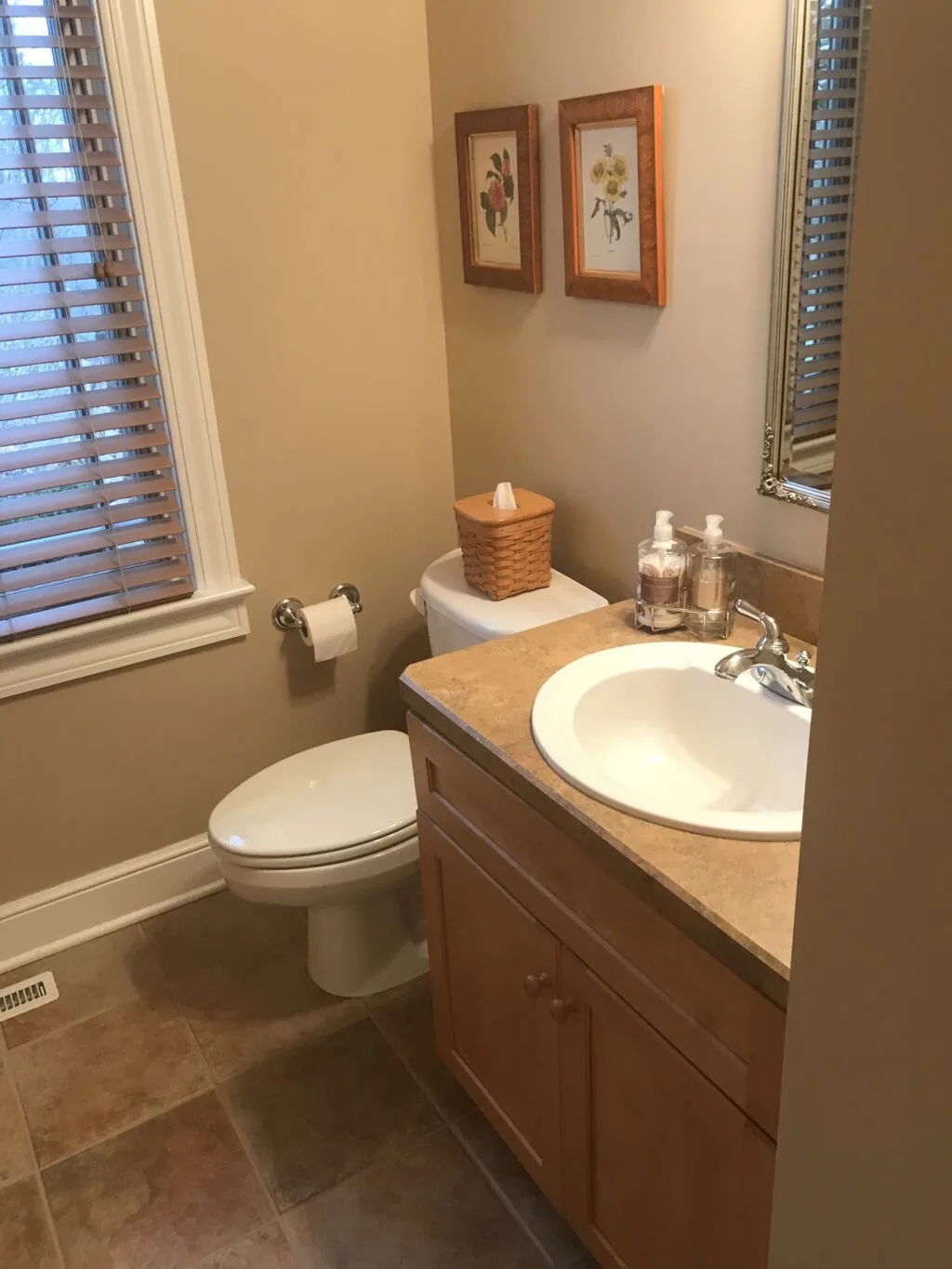 Powder room with oak vanity before picture