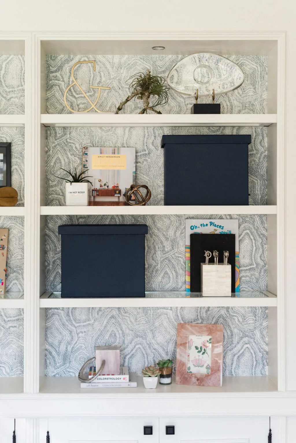 Bookshelf with wallpaper backing
