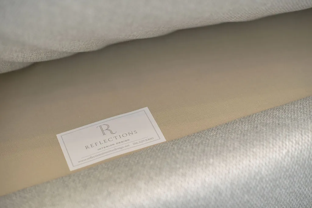Reflections furniture tag underneath sofa cushion for questions / contact info