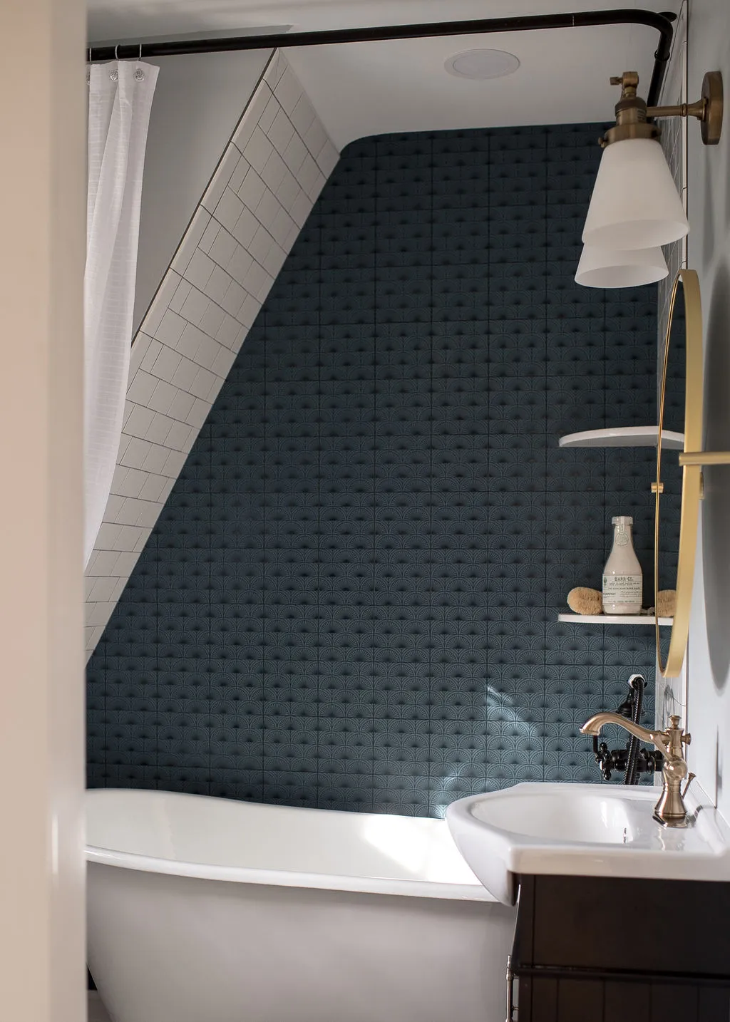 new bathroom design featuring clawfoot tub and dark tiles
