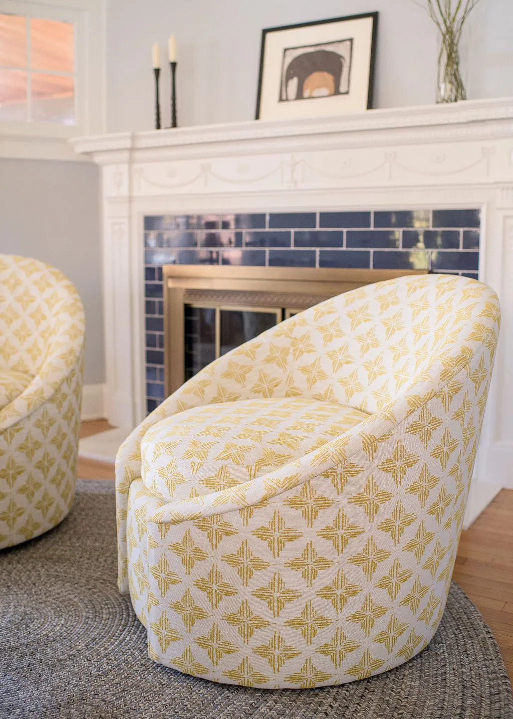 fireplace seating in bright yellow hues and a fun pattern on the upholstery