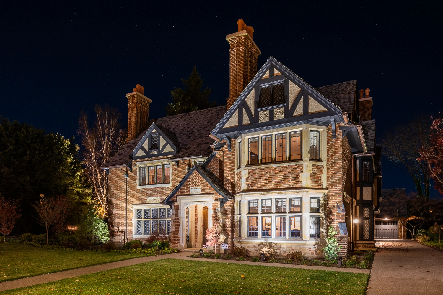 Exterior of traditonal tudor home in Erie, PA in the evening