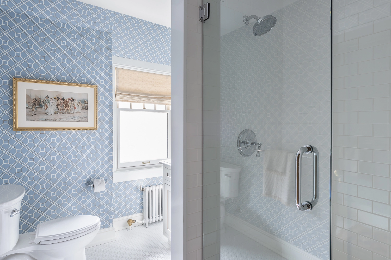Bathroom with blue diamond wallpaper and glass shower doors