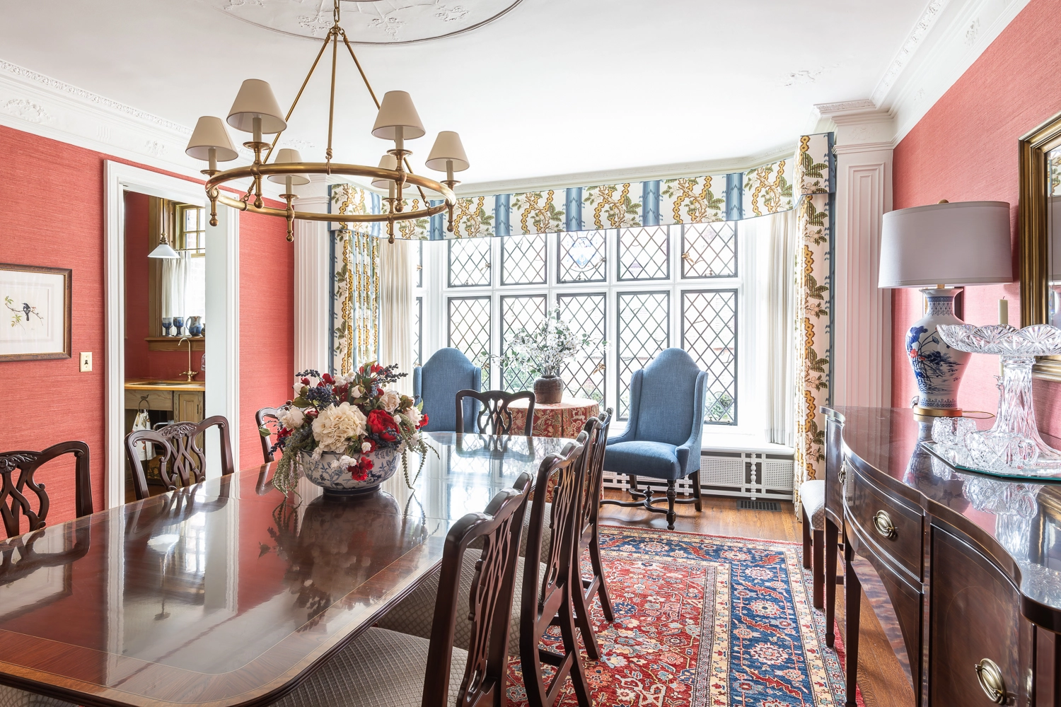 Image of traditional dining room facing glass windows