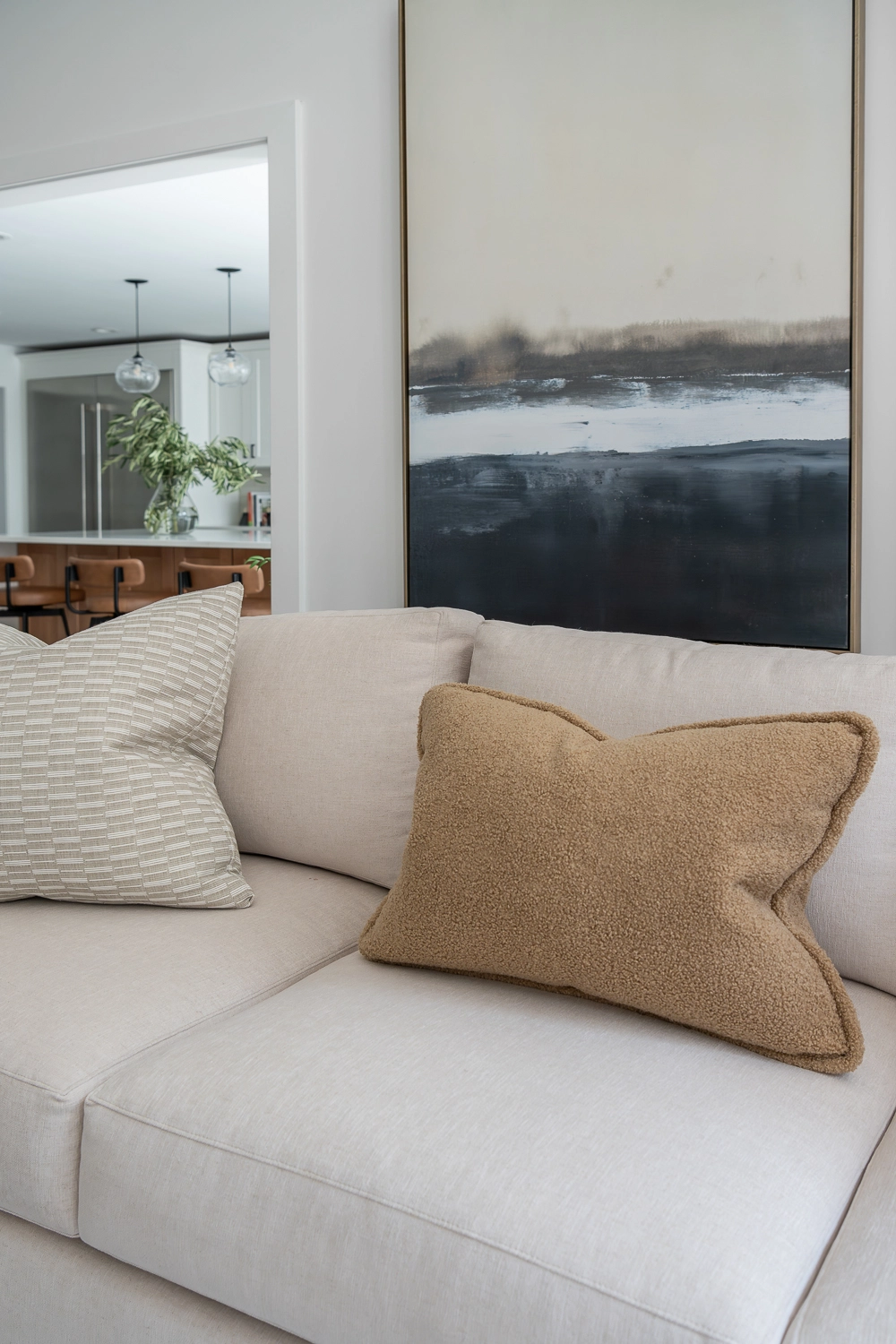 Luxury living room modern sofa with velvet pillow and blue abstract artwork