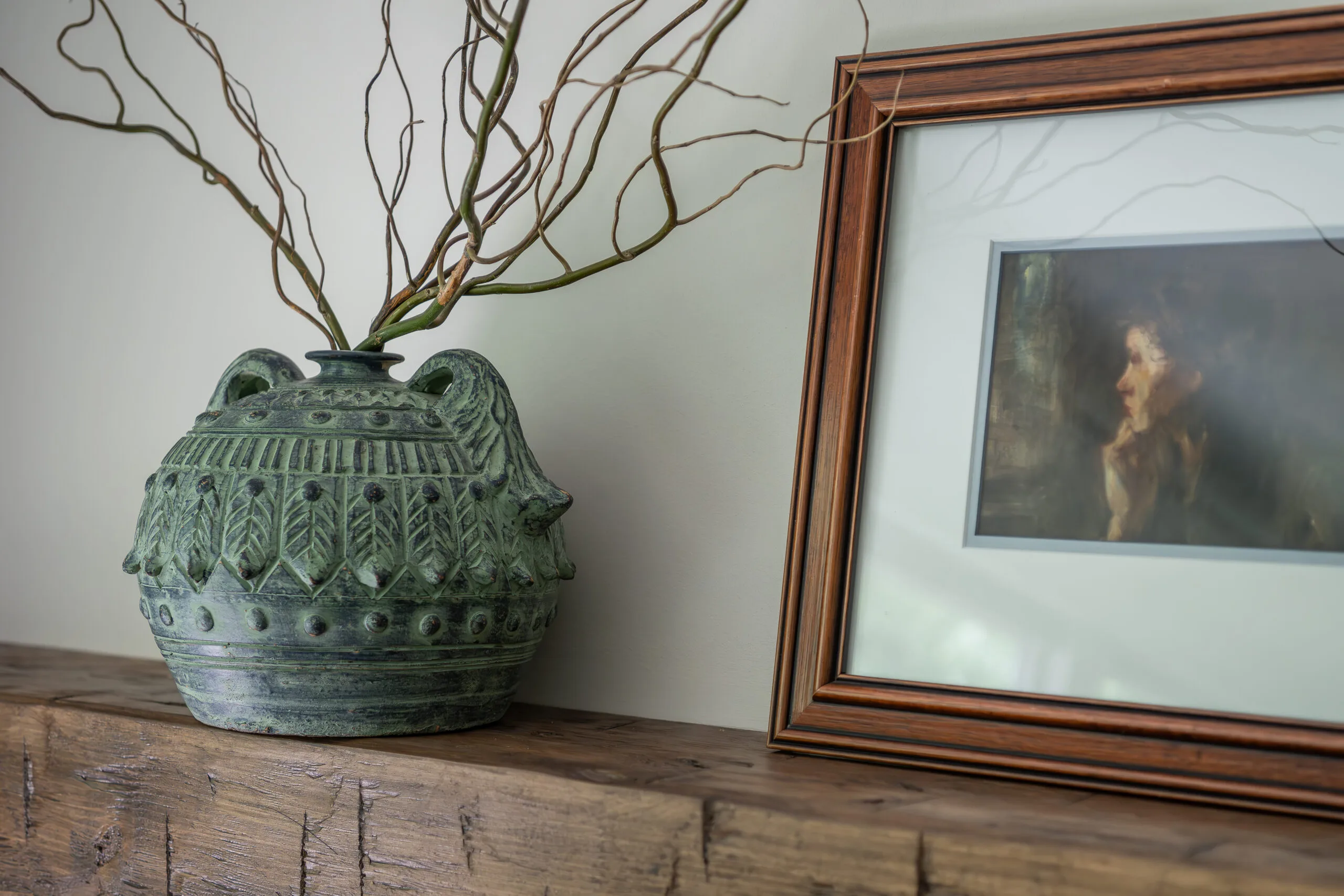 natural elemants on fireplace mantle with floating wood rough beam mantle