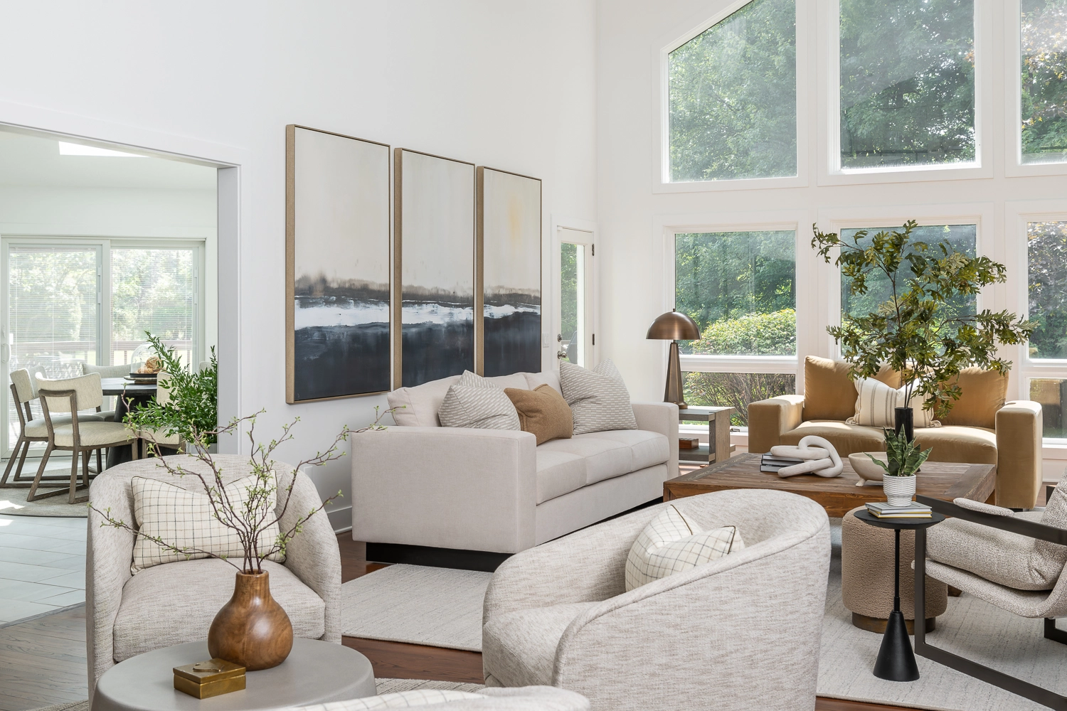 Great Room with modern plaster fireplace & neutral furniture