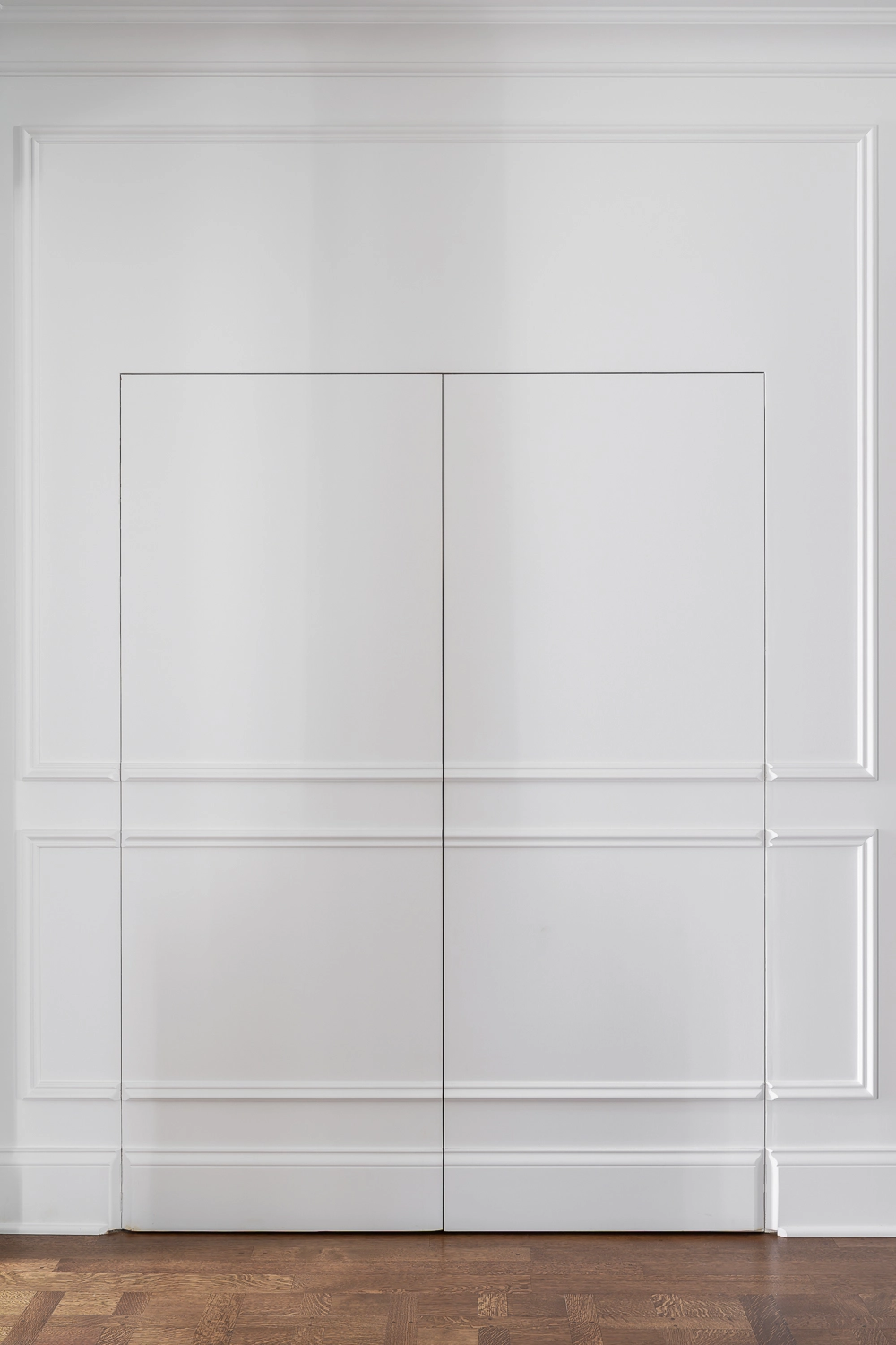 Luxury Home Gym with traditional millwork and hidden closet