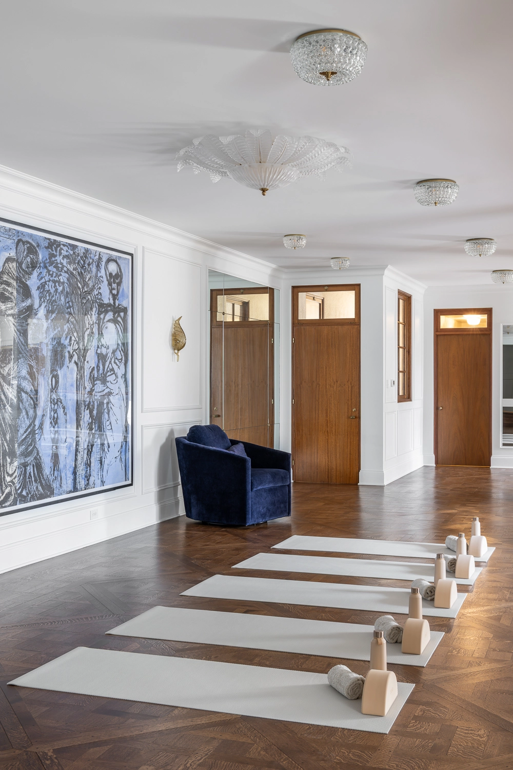 Luxury Home Gym with traditional millwork and modern art and furniture