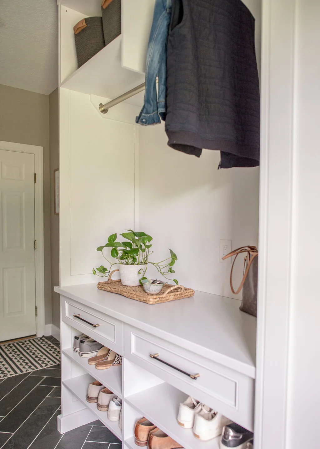 Mudroom organization with shoe and coat storage