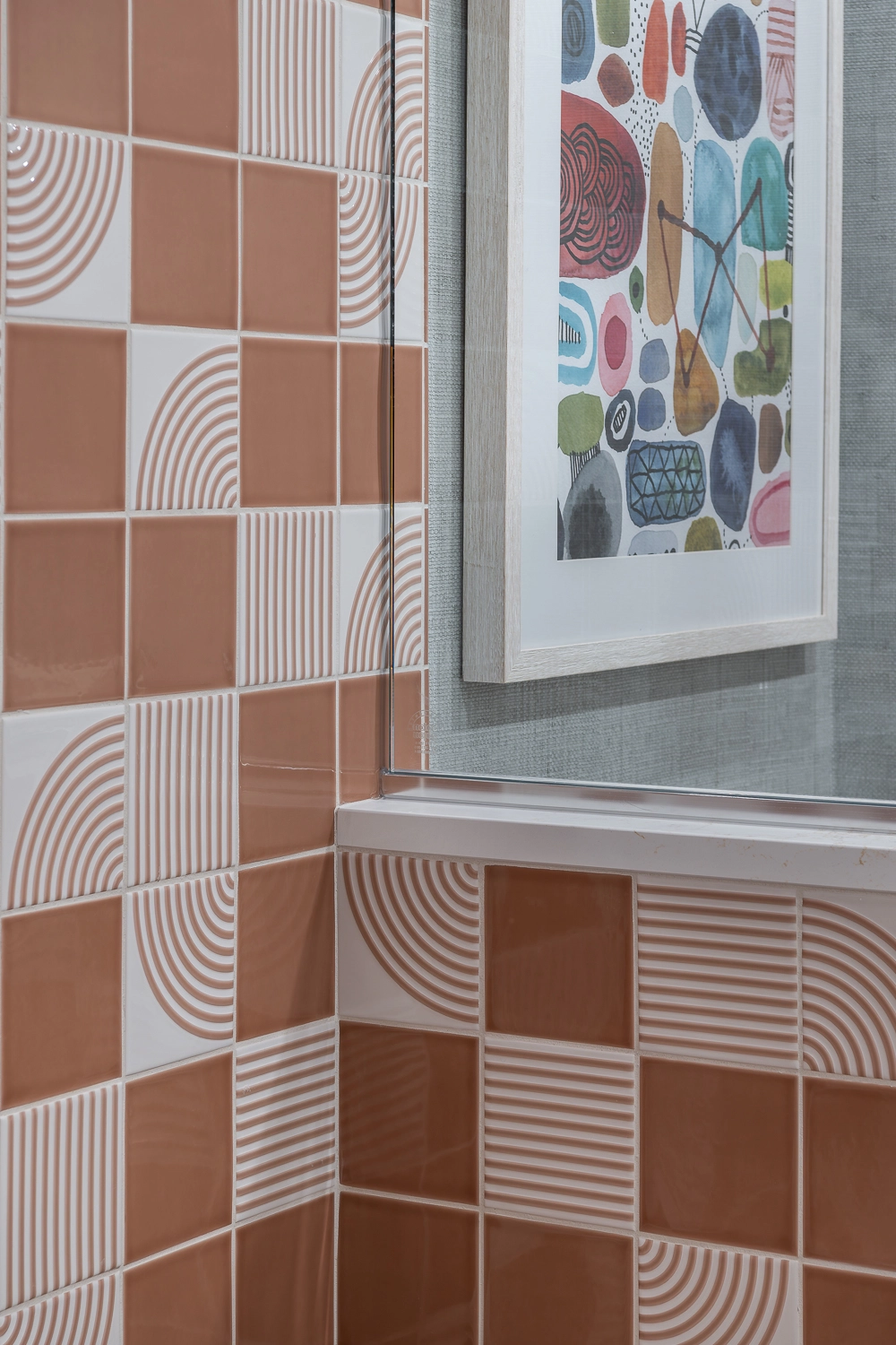 image of coral modern tile in shower with playful artwork in the background