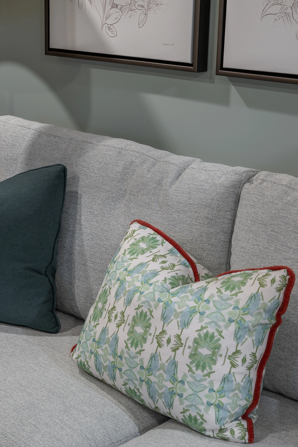 inviting plush sofa with green fun patterned pillow